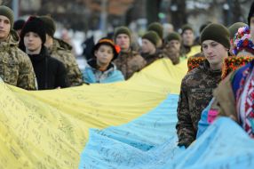 The largest National flag with wishes from children and military