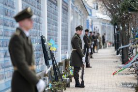 Laying flowers at the memorial wall of those who died in the Russian-Ukrainian war