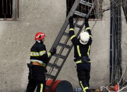 Rescuers put out the fire at the service station