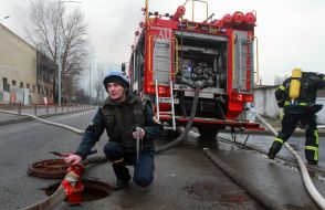 Rescuers during the liquidation of the consequences of a rocket attack