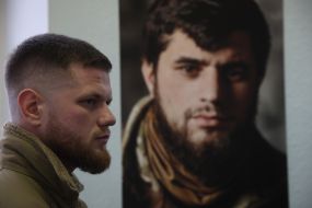 Sergei Filimonov near the portrait of Dmitry Kotsyubailo