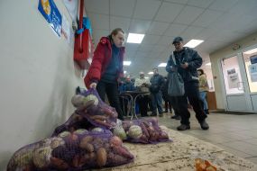 People receive humanitarian aid in the city of Vovchansk