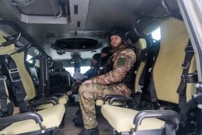 Police officers in an armored car