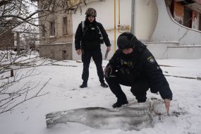 Experts study a fragment of a KAB-50 aerial bomb