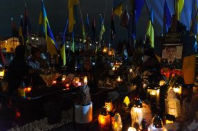 Lighted lamps on the graves of fallen servicemen at the Lychakiv cemetery