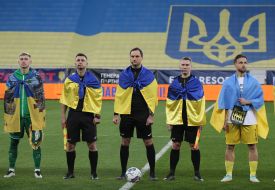 Referees and team captains before the start of the match
