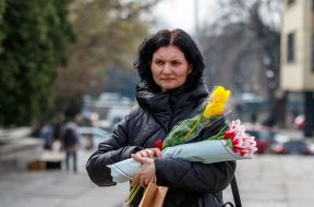 A woman with bouquets of tulips