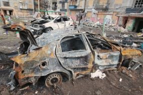 Cars destroyed as a result of shelling by Russian rockets near a residential building in the "Svitly" microdistrict of the city of Myrnograd