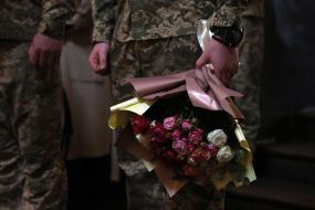 Military chaplain with flowers