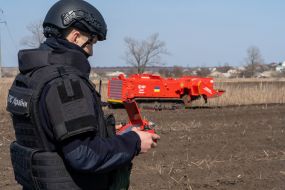 Sapper controls a robotic mine clearing machine