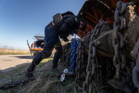 Sapper controls a robotic mine clearing machine