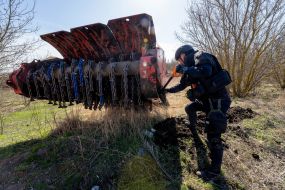 Sapper controls a robotic mine clearing machine