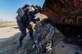 Sapper controls a robotic mine clearing machine