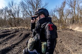 Sapper controls a robotic mine clearing machine