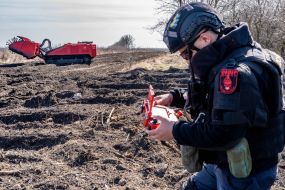 Sapper controls a robotic mine clearing machine