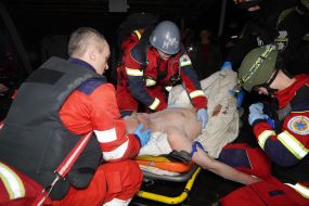 Ambulance doctors examining a victim