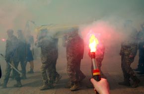 A fire was lit during the farewell to junior sergeant Pavlo Petrichenko near St. Michael's Cathedral in Kyiv