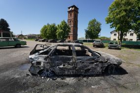 A car destroyed as a result of enemy shelling by guided aerial bombs in the village of Zolochiv