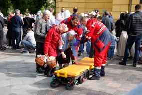 Emergency doctors provide first aid to an elderly woman