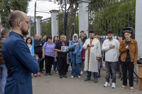 Participants of the performance event for the 80th anniversary of the deportation of the Crimean Tatar people perform the national anthem of Ukraine at the railway station in Odesa