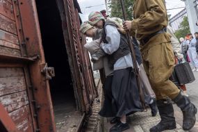 Participants of the performance event for the 80th anniversary of the deportation of the Crimean Tatar people at the railway station in Odessa