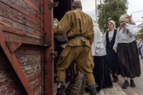 Participants of the performance event for the 80th anniversary of the deportation of the Crimean Tatar people at the railway station in Odessa