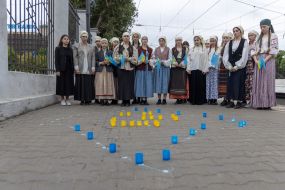 Participants of the performance event for the 80th anniversary of the deportation of the Crimean Tatar people at the railway station in Odessa