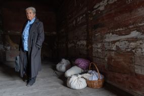 A woman in a freight car, similar to the one that transported Crimean Tatars from Crimea to Uzbekistan, at the railway station in Odesa