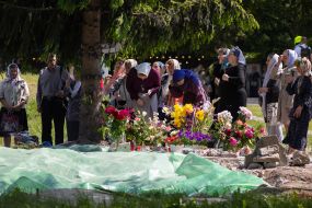 Parishioners near the place where the dismantled UOC chapel stood