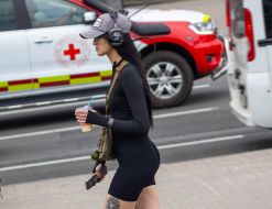 A girl in headphones and a cap