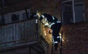 Rescuers are sorting through the rubble of an apartment building in Kharkiv that was destroyed by a Russian missile