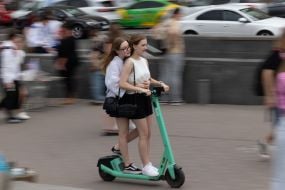 A girl on a scooter