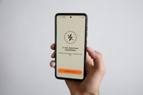 Mobile application "Rezerv+" on the screen of a mobile phone