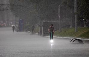 A man on an electric scooter in the center of Kyiv