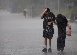 Passersby in the rain in the center of Kyiv