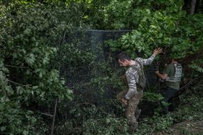 Military personnel set up positions