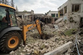Special equipment rakes away the debris resulting from guided aerial bomb attacks on Kharkiv