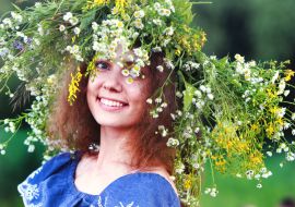 A young woman in a wreath of wild flowers