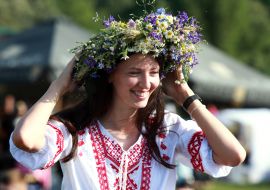 A young woman in a wreath of wild flowers