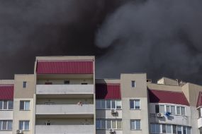 A residential building near warehouses of a retail chain that caught fire as a result of a cruise missile attack in Odesa