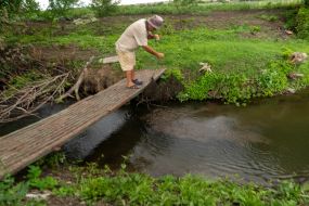 A local resident, 57-year-old Sergei Lysenko, fishes in a stream