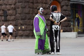 Animators in clown and skeleton costumes