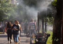 People near the frame with water sprays