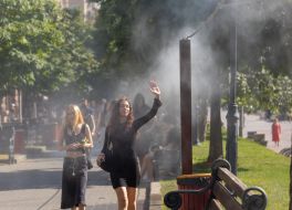 People near the frame with water sprays