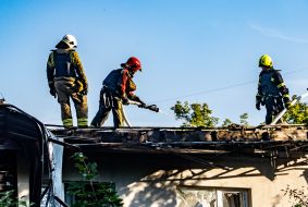 Rescue workers eliminate the consequences of the Russian occupiers' attacks on the private sector in Kharkiv