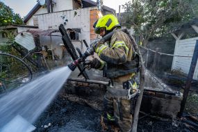 Rescue workers eliminate the consequences of the Russian occupiers' attacks on the private sector in Kharkiv