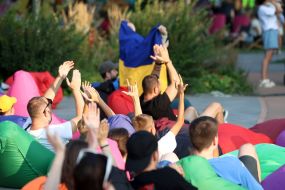 Spectators watch the match of the group stage of the 2024 Olympic Games between the national teams of Ukraine and Morocco in the Olympic fan zone