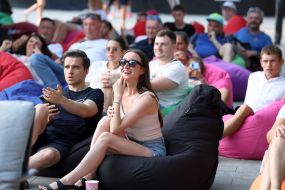 Spectators watch the match of the group stage of the 2024 Olympic Games between the national teams of Ukraine and Morocco in the Olympic fan zone