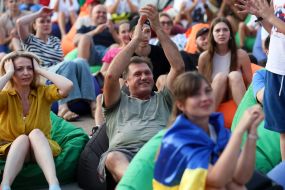 Spectators watch the match of the group stage of the 2024 Olympic Games between the national teams of Ukraine and Morocco in the Olympic fan zone