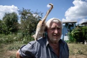 A man with a cat